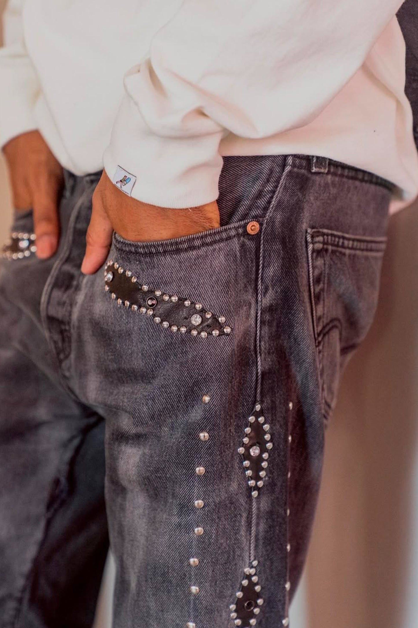 LEATHER STUDS DENIM PANTS