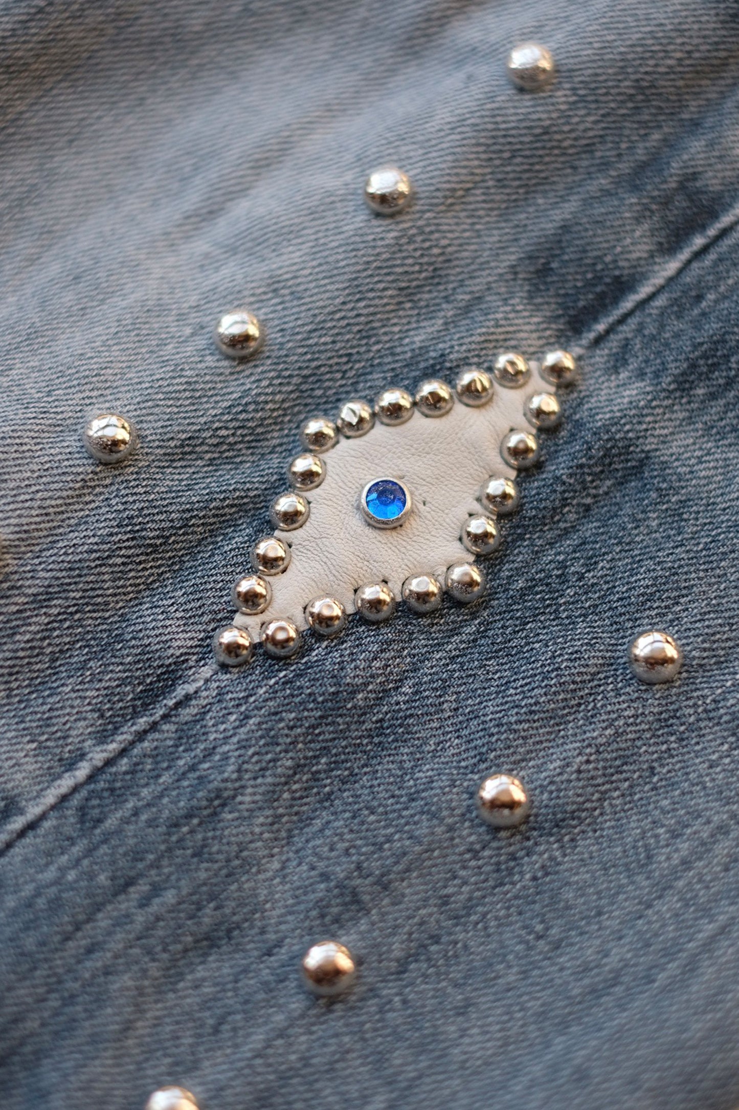 LEATHER STUDS DENIM PANTS